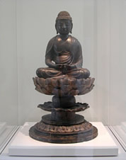 [Buddha statue carved from nutmeg wood]